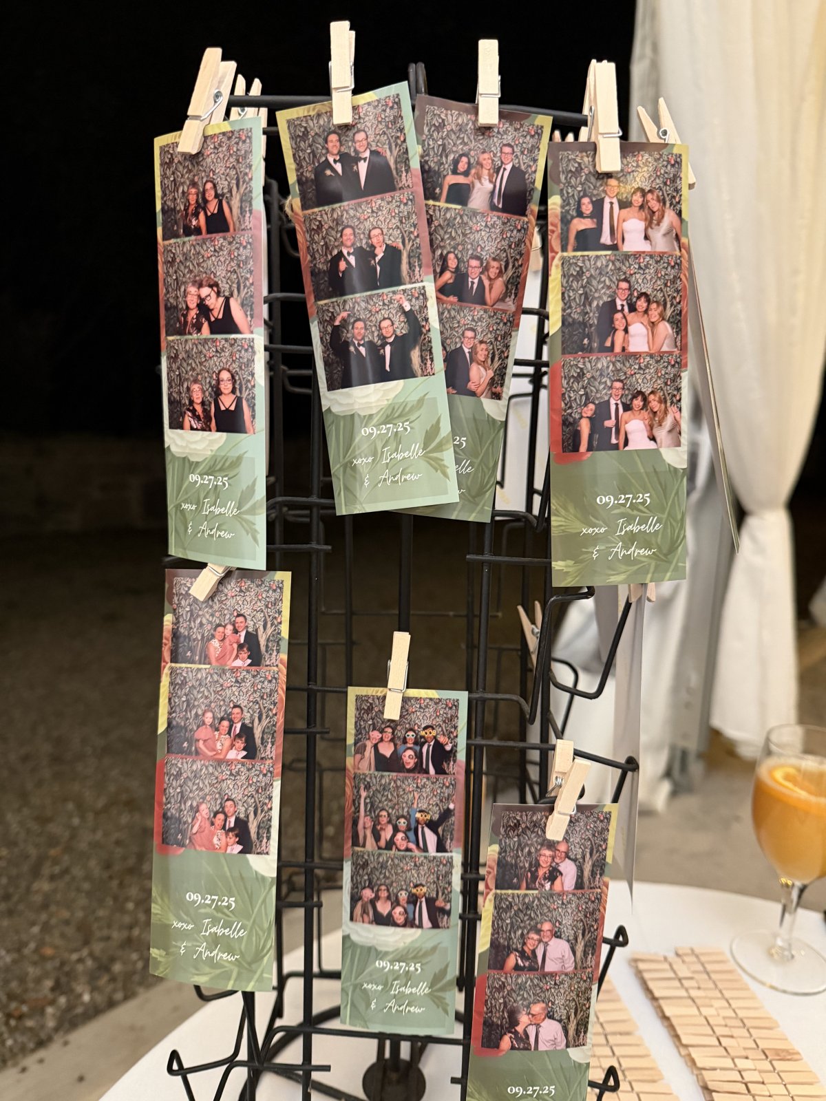 Green wedding photo strips clipped to a display stand